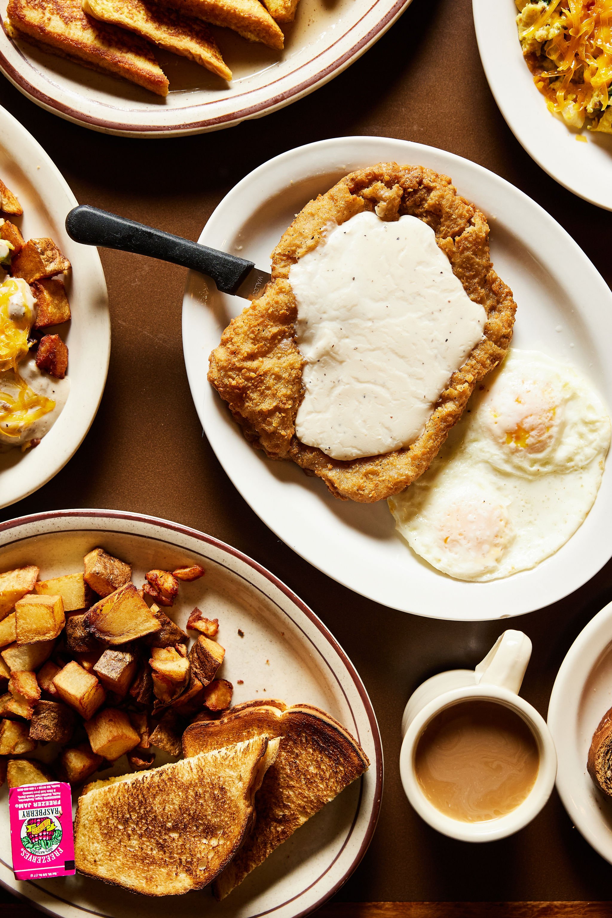 Chicken fried steak with gravy and eggs