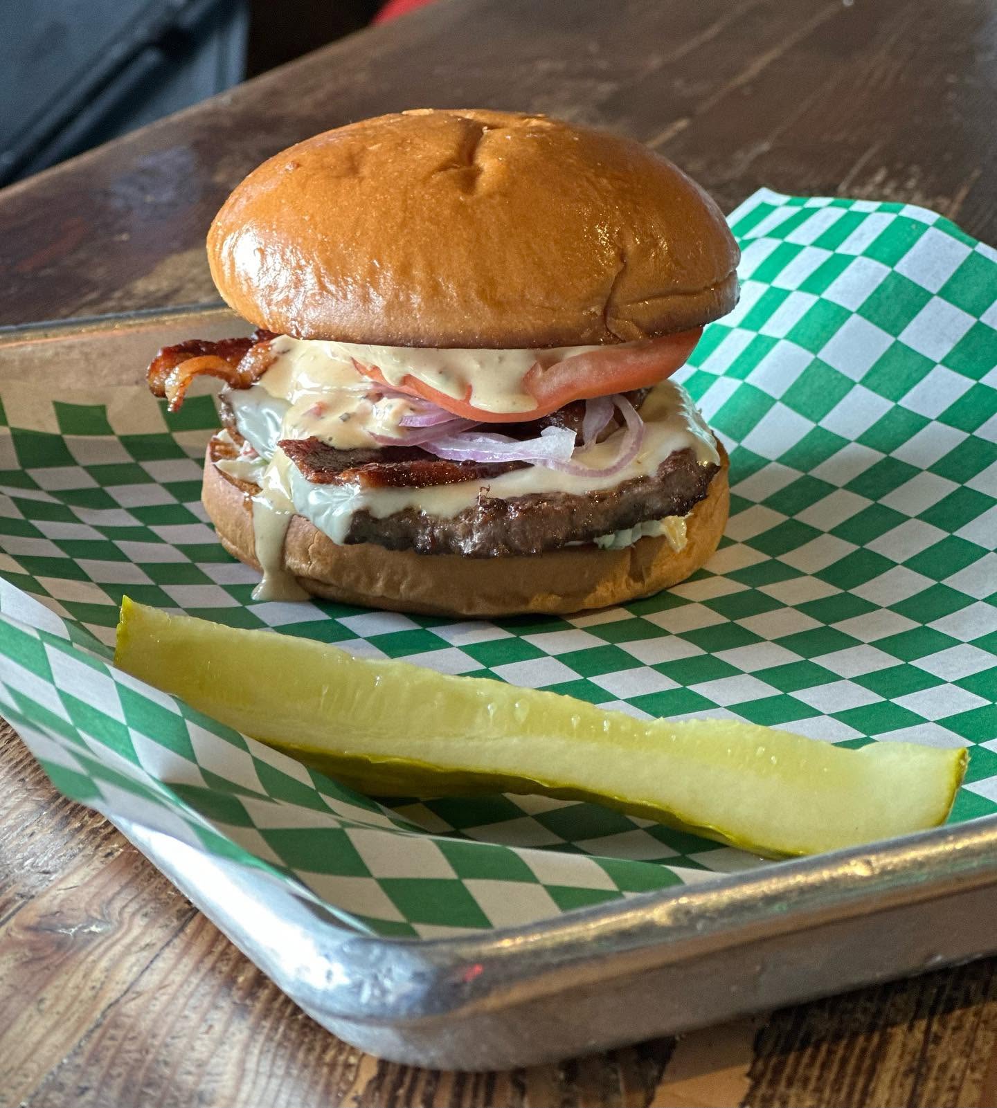 Cheeseburger with tomato and onion at The Valley