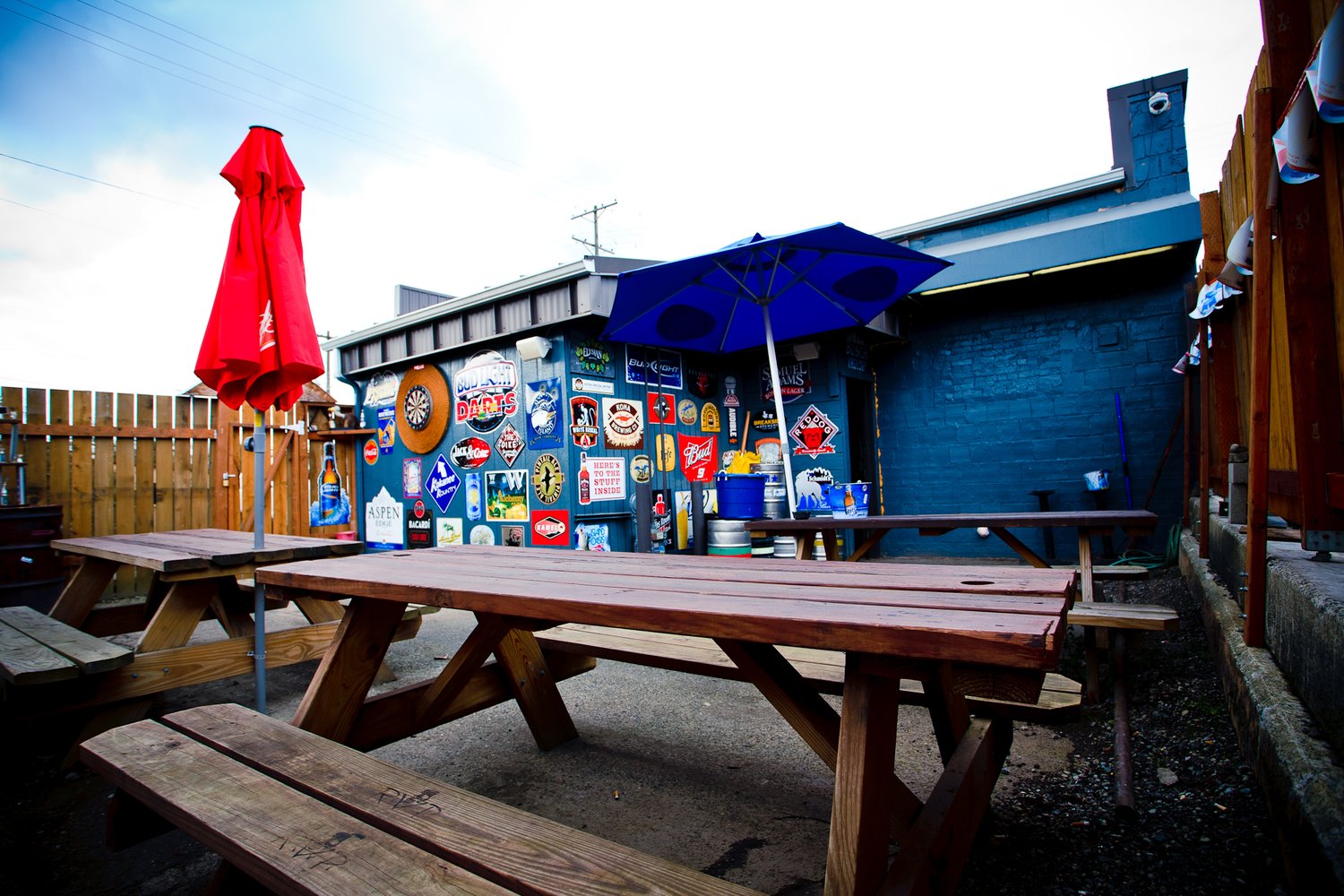 Patio tables and beer-sign wall